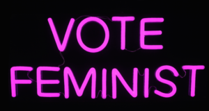 Artist Michele Pred’s New Solo Exhibition ‘Vote Feminist’ Is A Call To Resist Ahead Of Mid-Terms