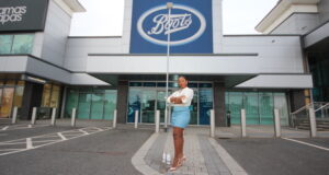 Kam Davis, founder of Nylah's Naturals, stands outside a Boots store in the UK